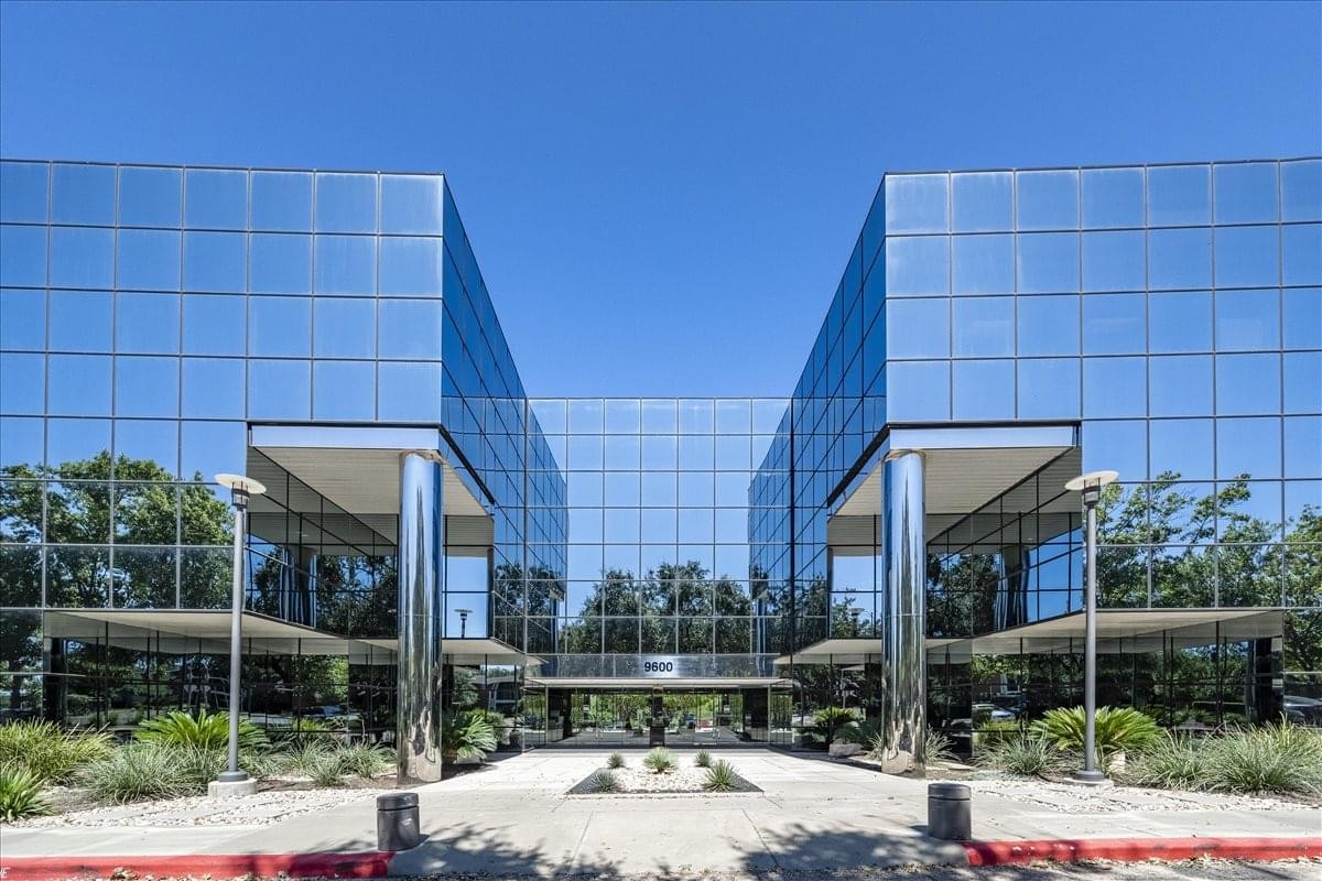Exterior view of the mirrored glass facade at Arboretum Great Hills Center.