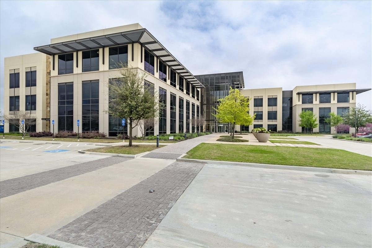 Exterior view of the multi-story professional building at 9800 Hillwood Parkway.