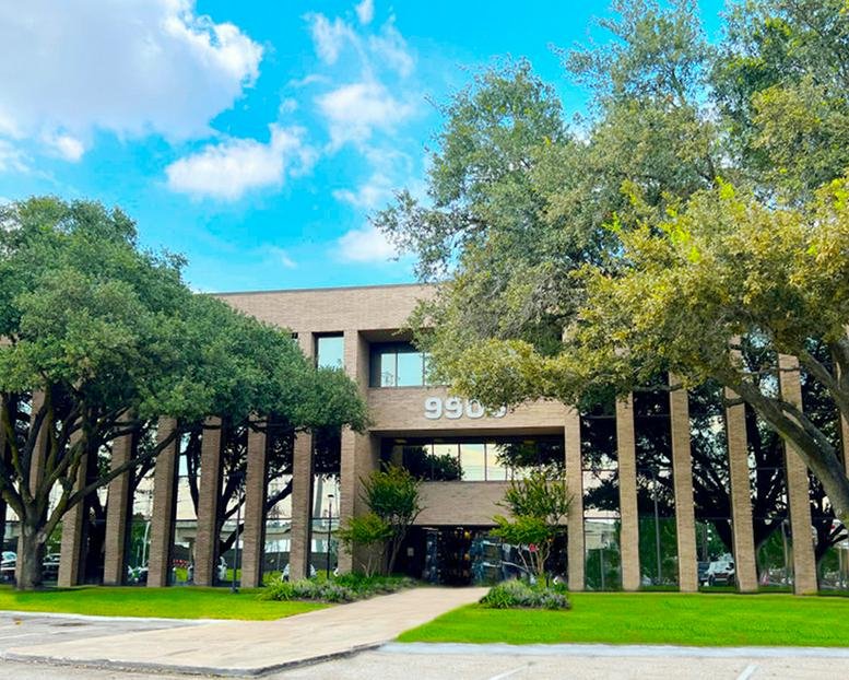 Exterior view of the professional brick and glass building at 9900 Westpark, Houston, Texas.