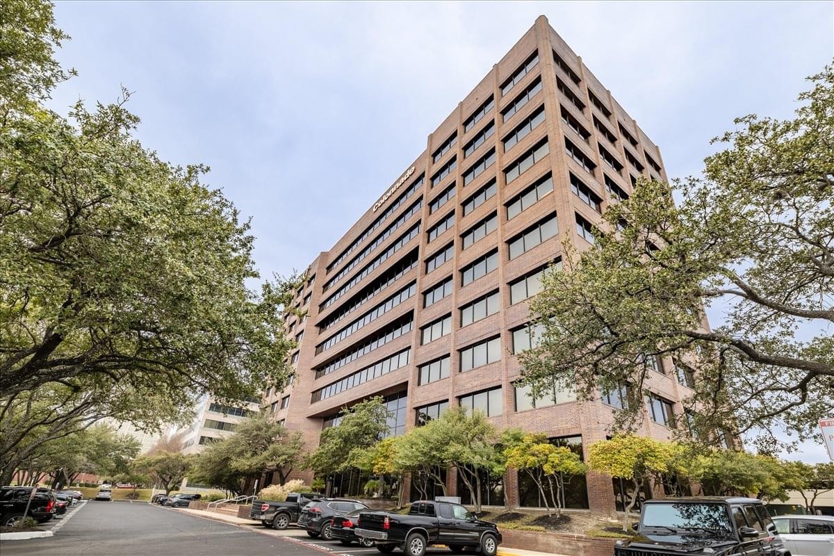 Exterior view of the multi-story brick facade at 9901 I. H. 10 West, Suite 800.