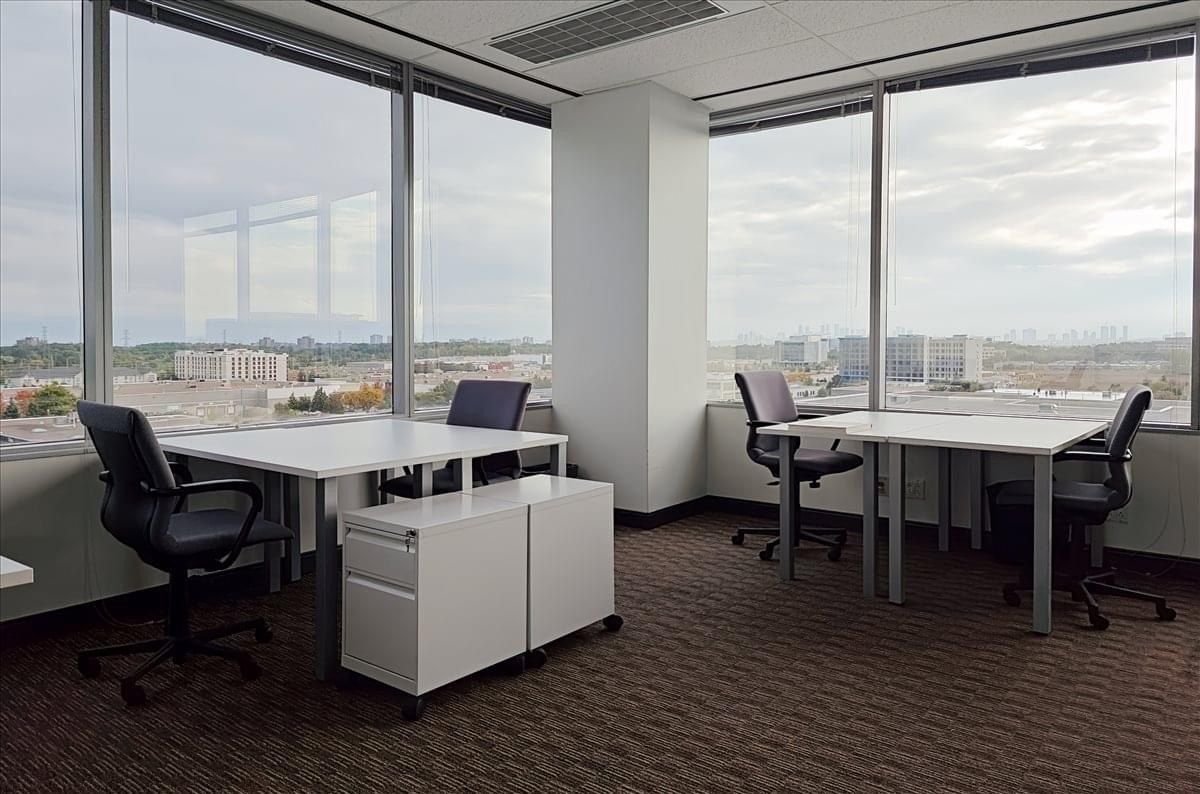 Bright private office with corner windows and city views at the 8th Floor, Airport Corporate Centre.