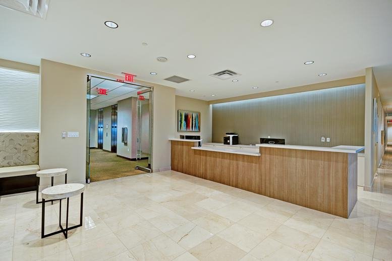 Spacious wood-paneled reception area and lobby at Allen Central Park, 700 South Central Expressway.