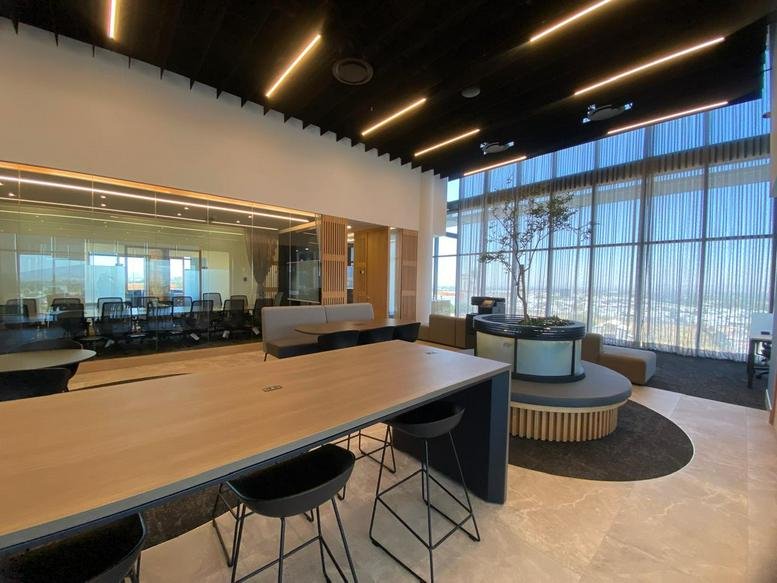 Spacious communal lounge at Av. Ejército Nacional No. 453, Col. Granada, Mexico City with floor-to-ceiling windows.