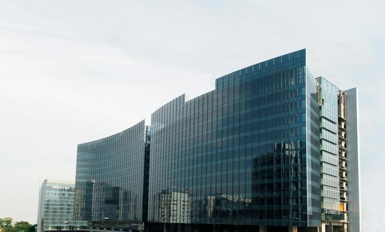 Modern glass exterior of the IZA BC Park Plaza building in Santa Fe.