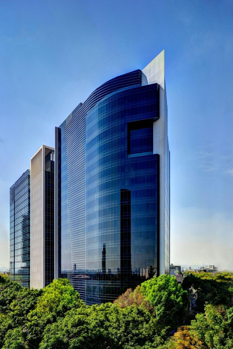 Exterior view of the blue glass facade skyscraper at Avenida Insurgentes Sur No. 859.