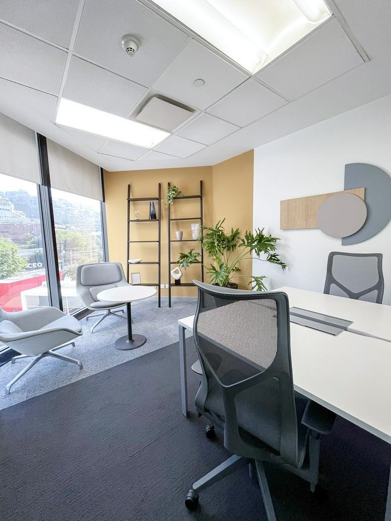 Private corner office at Torre Alestra, Avenida Lázaro Cárdenas, Monterrey with modern furniture and city views.
