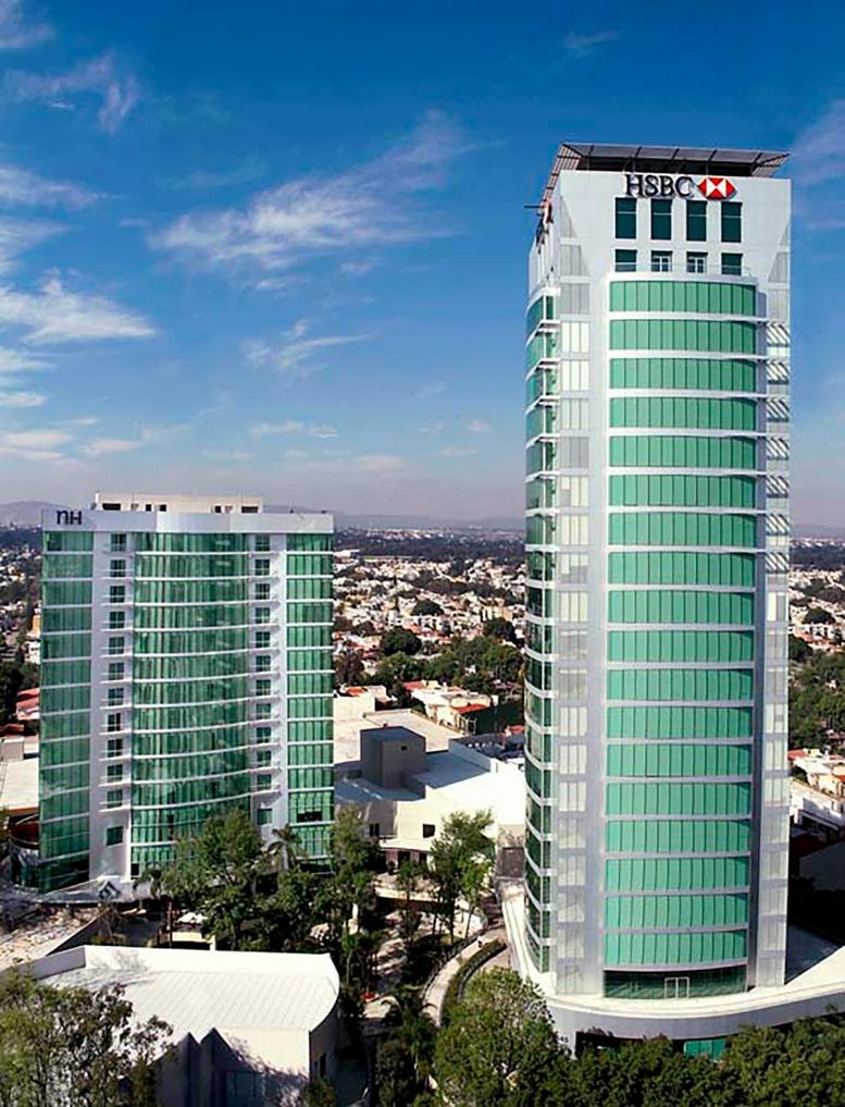 Exterior of the HSBC tower with green glass facade.