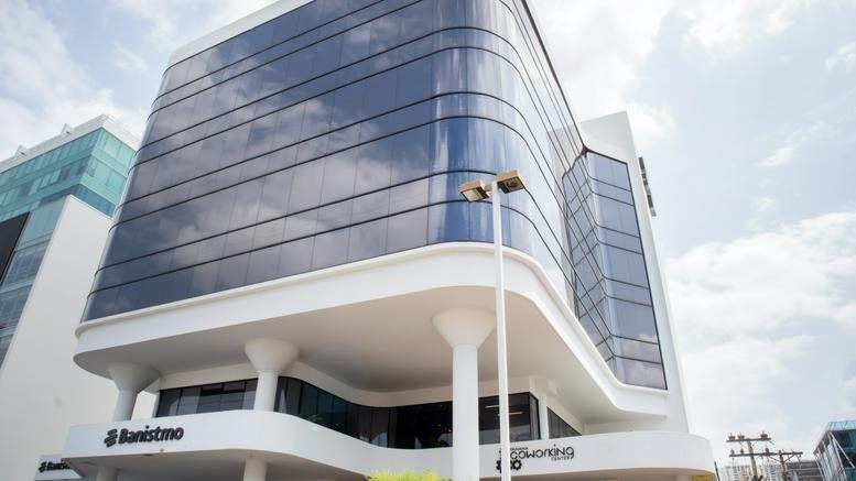 Exterior view of the modern glass-facade Torre Banistmo building.