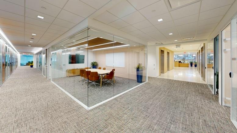 Spacious glass-walled boardroom at the Capitol Hill Center, Suite 900, 300 New Jersey Avenue NW.