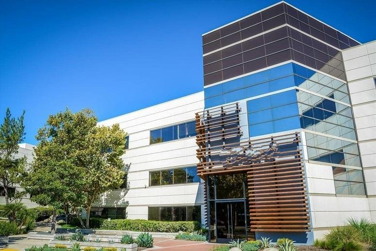 Modern exterior of the (CCC) Corporate Center Calabasas featuring glass windows and architectural wood detailing.