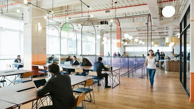 Spacious open-plan workspace at Cervantes, Boulevard Miguel de Cervantes Saavedra 169 with industrial ceiling.