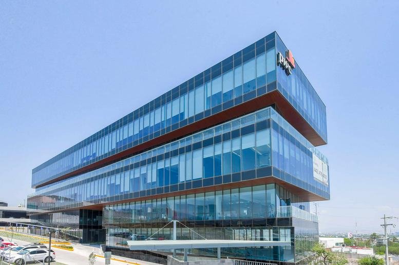 Exterior view of the multi-level glass and steel facade at Chilpancingo 71, Hipodromo Condesa.