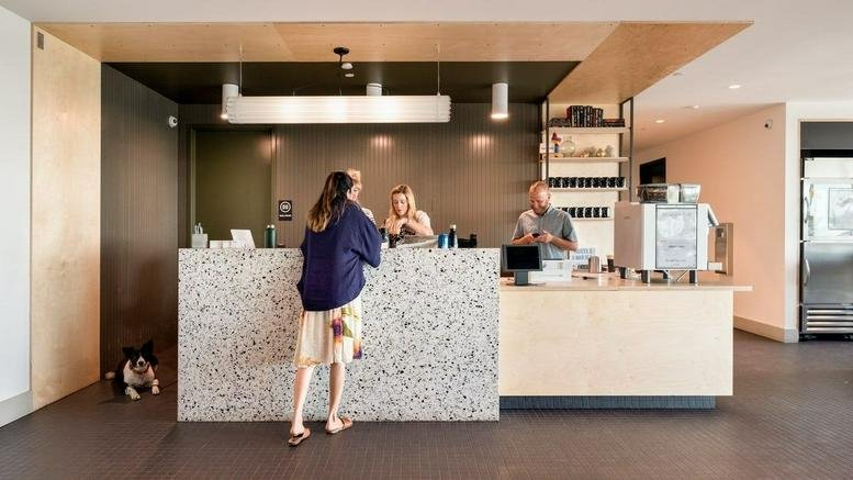 Bright reception area with a speckled stone desk at Clearfork, 5039 Edwards Ranch.