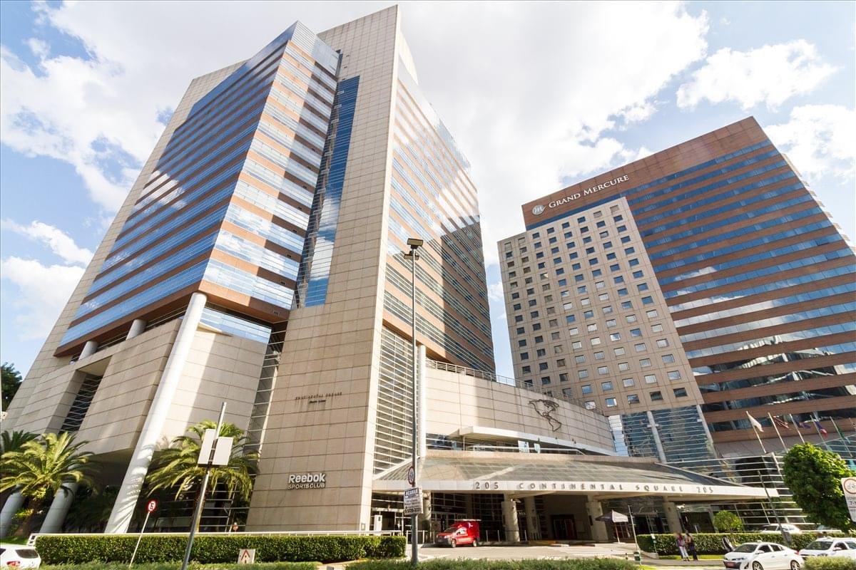 Exterior view of the multi-tower Continental Square complex with modern glass and stone facades.