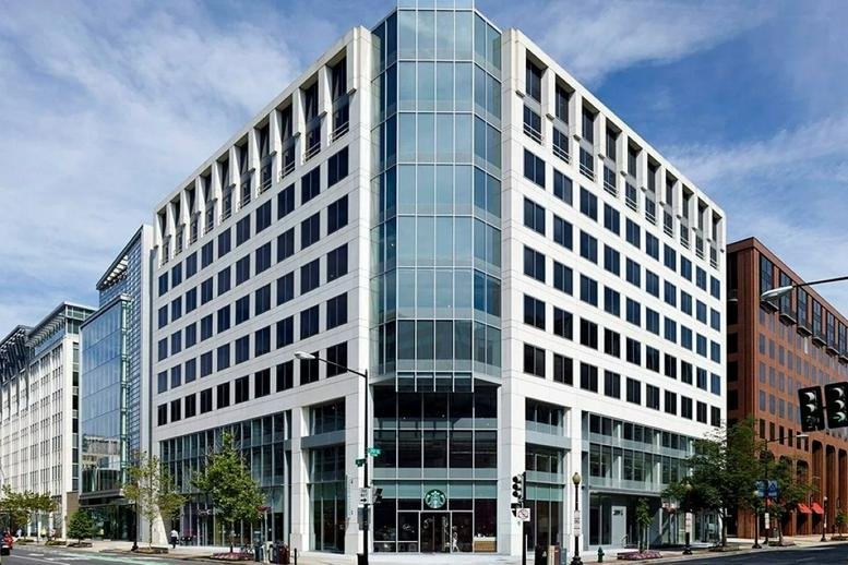 Exterior view of the modern glass and white facade at (DC2) 2001 L Street N. W.