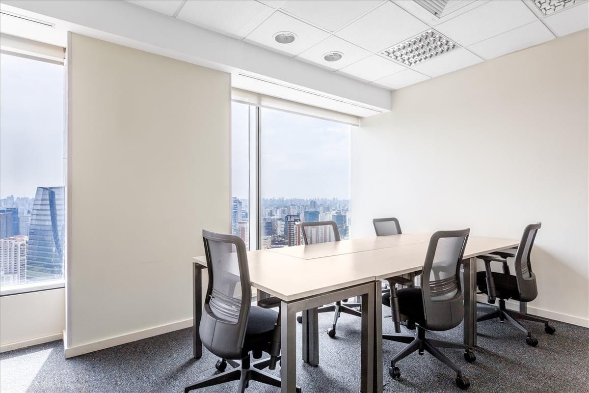 Meeting room with large windows at E Tower, Floors 34 & 35, Rua Funchal 418.