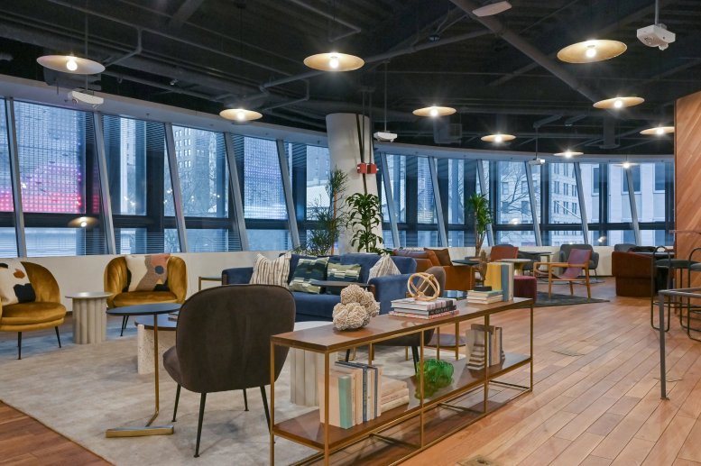 Spacious communal lounge at Fulton Center, 2nd Floor, 200 Broadway with mid-century furniture and city views.