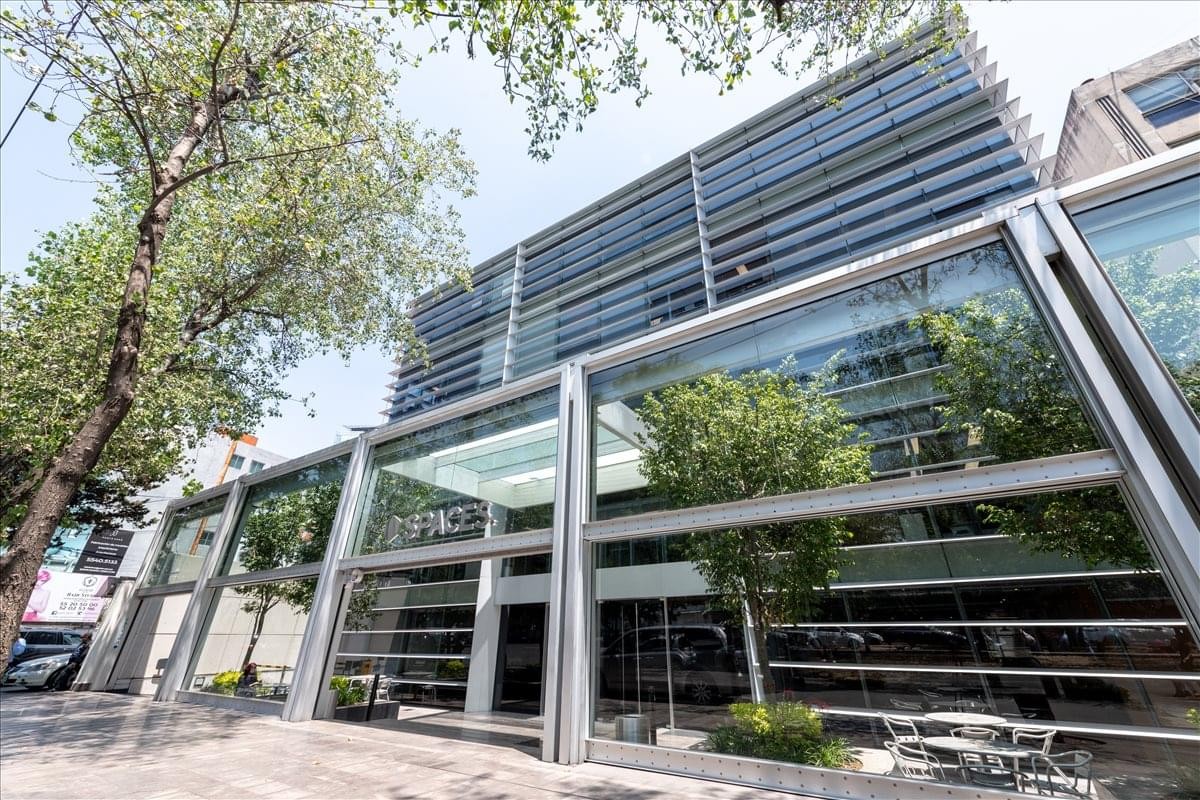 Modern glass and steel exterior of Prado Sur 150 in Lomas de Chapultepec.