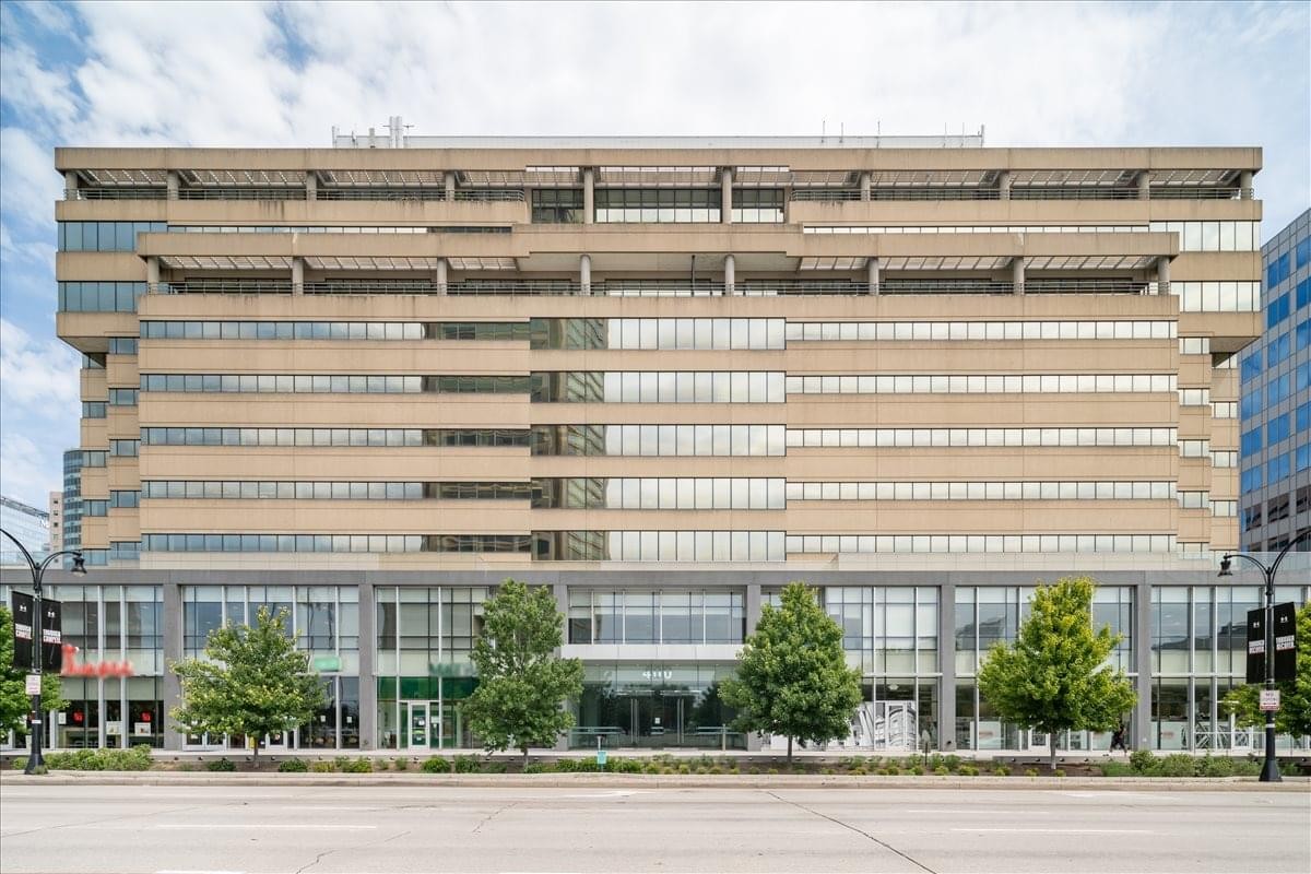 Exterior view of the multi-story Inner Harbour Centre with large glass windows and tan facade.