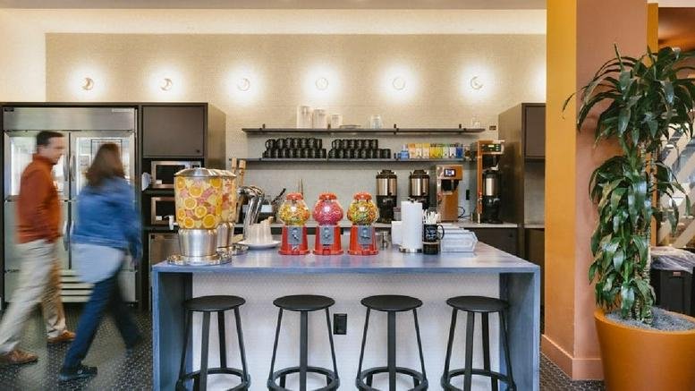 Breakout area at Legacy West, 7400 Windrose, Plano, Texas with snack bar, stools, and coffee station.