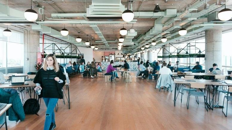 Wide view of a bright, industrial-style coworking space at Libertador 1000, Vicente Lopez, Buenos Aires, Argentina.