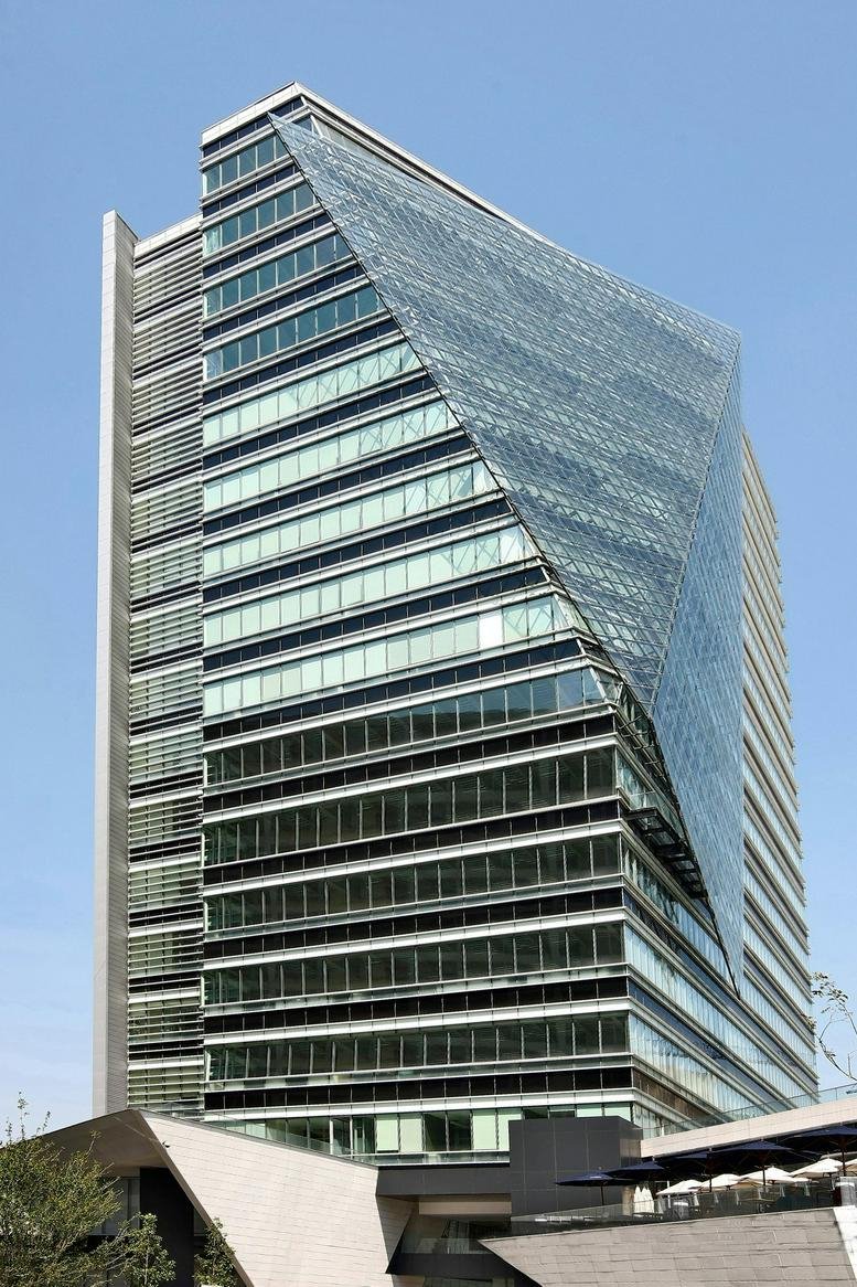 Exterior view of the modern geometric glass and steel building at Mario Pani 200, Santa Fe, Mexico City.