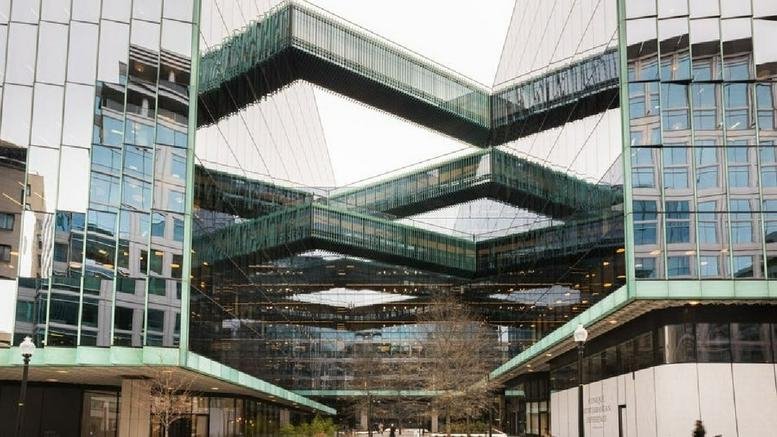 Exterior view of the glass-facade Midtown Center with unique geometric bridge walkways connecting building wings.