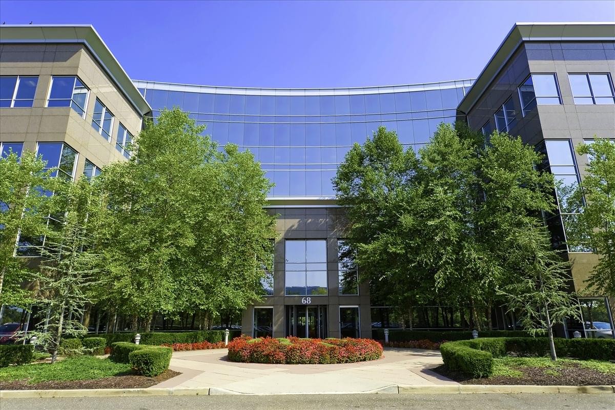 Exterior view of the modern glass and stone facade at NY, Long Island – Melville Expressway II.