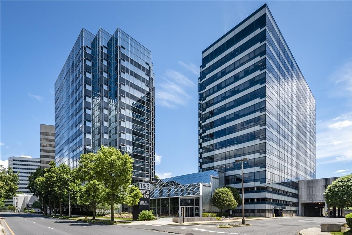 Exterior view of the glass-facade towers at One Stamford Plaza.