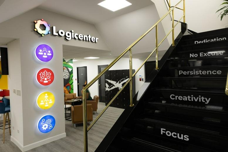 Reception entrance at PH Plaza Canaima with branded signage and motivational stairs.