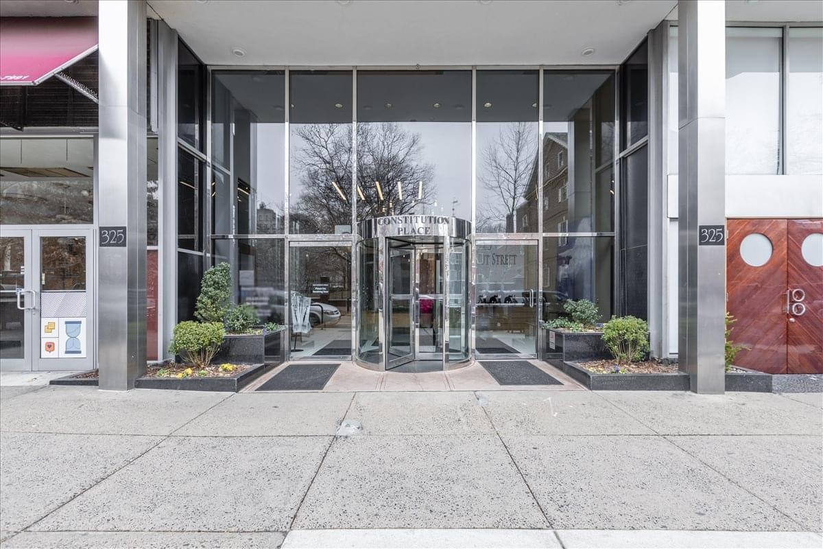 Exterior view of the glass entrance and revolving door at Philadelphia Market East, 325 Chestnut Street.