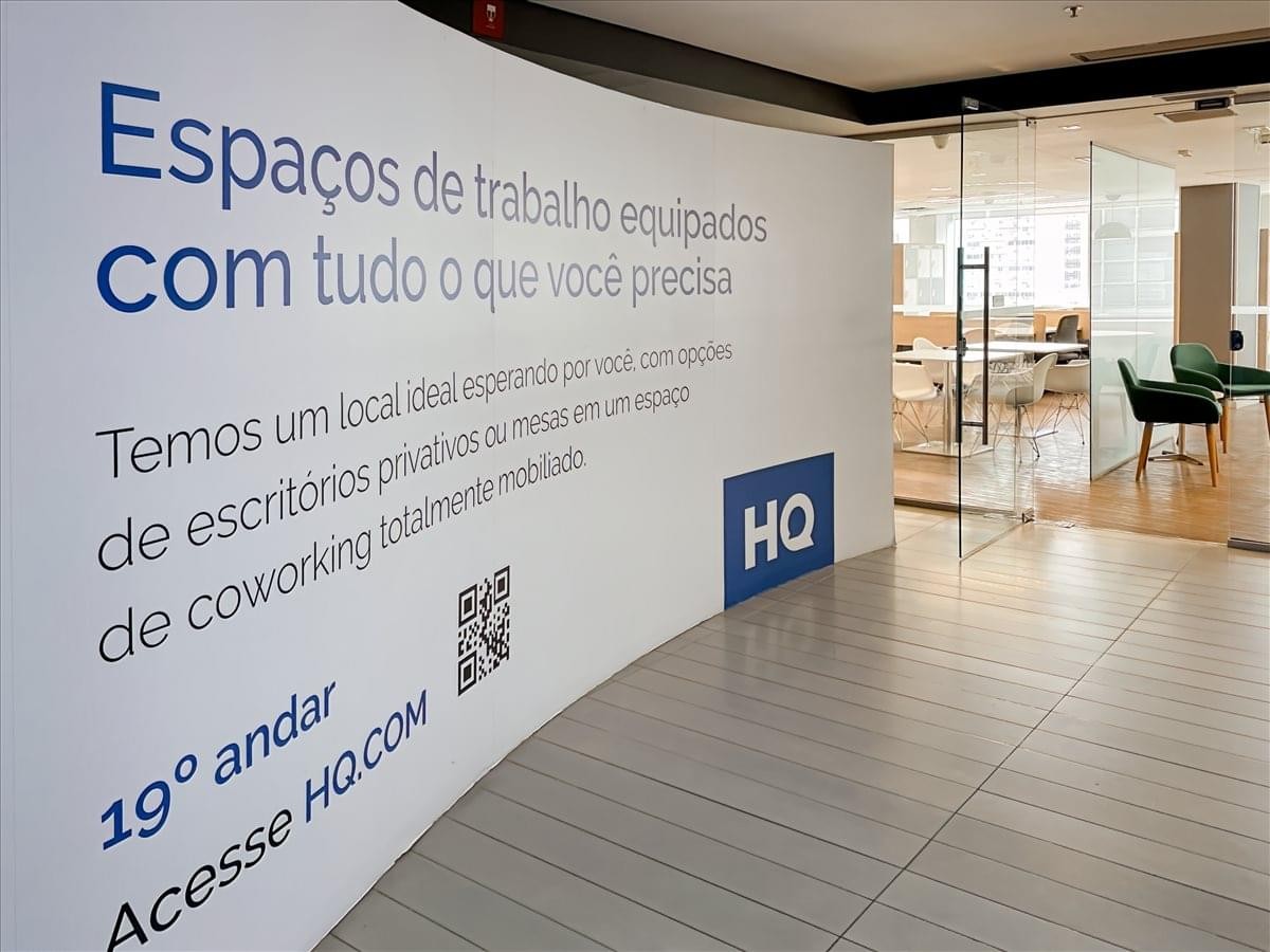 Entrance of the RB115 Building with branded signage and glass doors leading to a workspace.