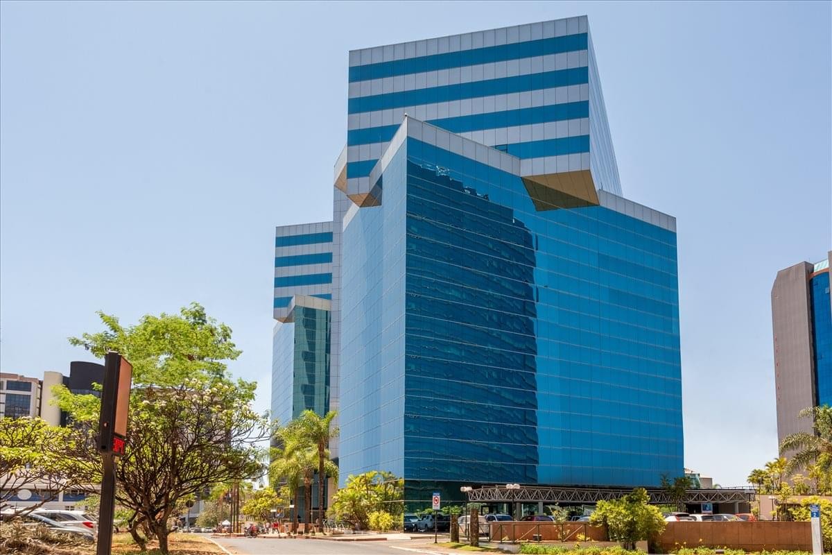 Modern glass facade of the Corporate Financial Center in Brasilia.