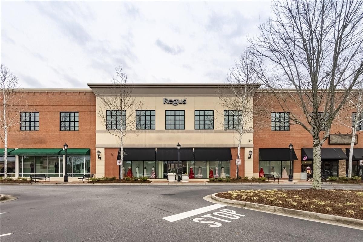 Brick facade and storefront entrance of the Shoppes at Webb Gin.