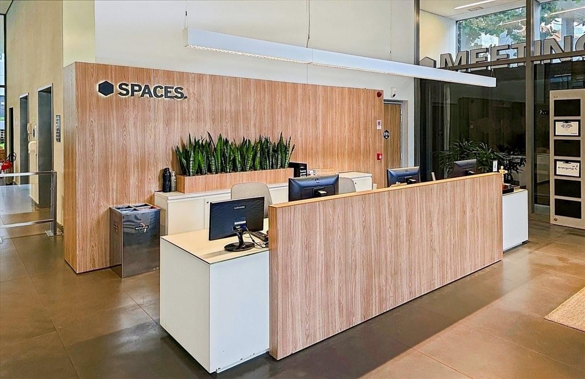 Reception desk of Spaces Villa Madalena, Capitao Antonio Rosa Steer, Jardim Paulistano, Sao Paulo with wood slats.