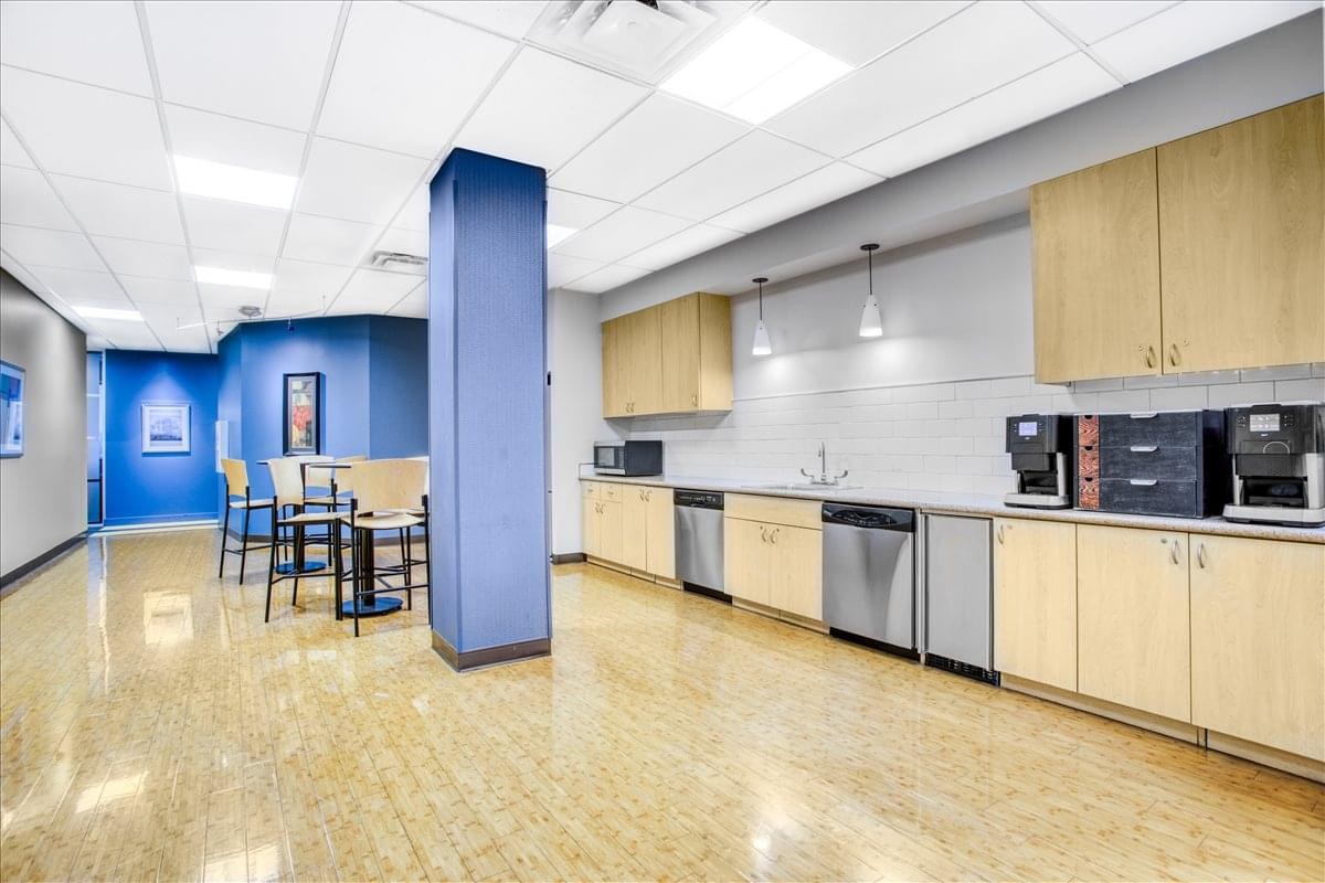 Modern communal kitchen and breakout area at St. Louis-Chesterfield, 100 Chesterfield Business Parkway.