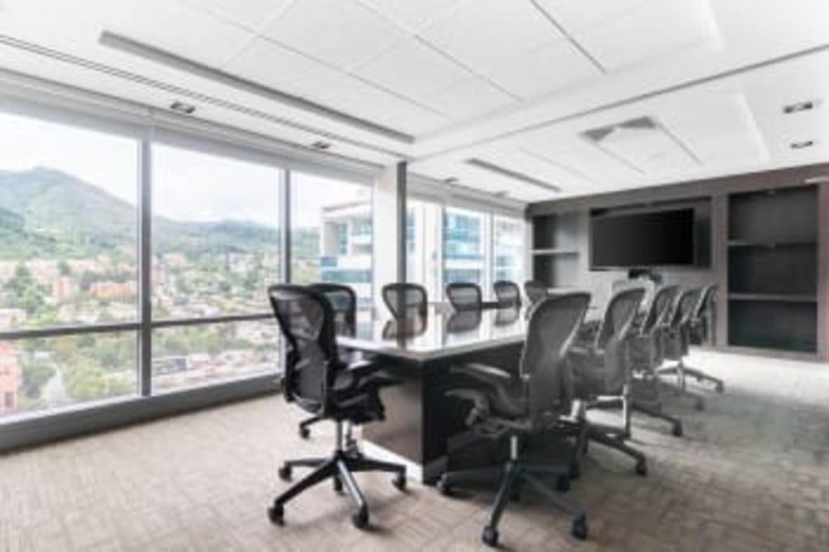 Large professional boardroom with views of the mountains from the 17th Floor Tierra Firme Tower.
