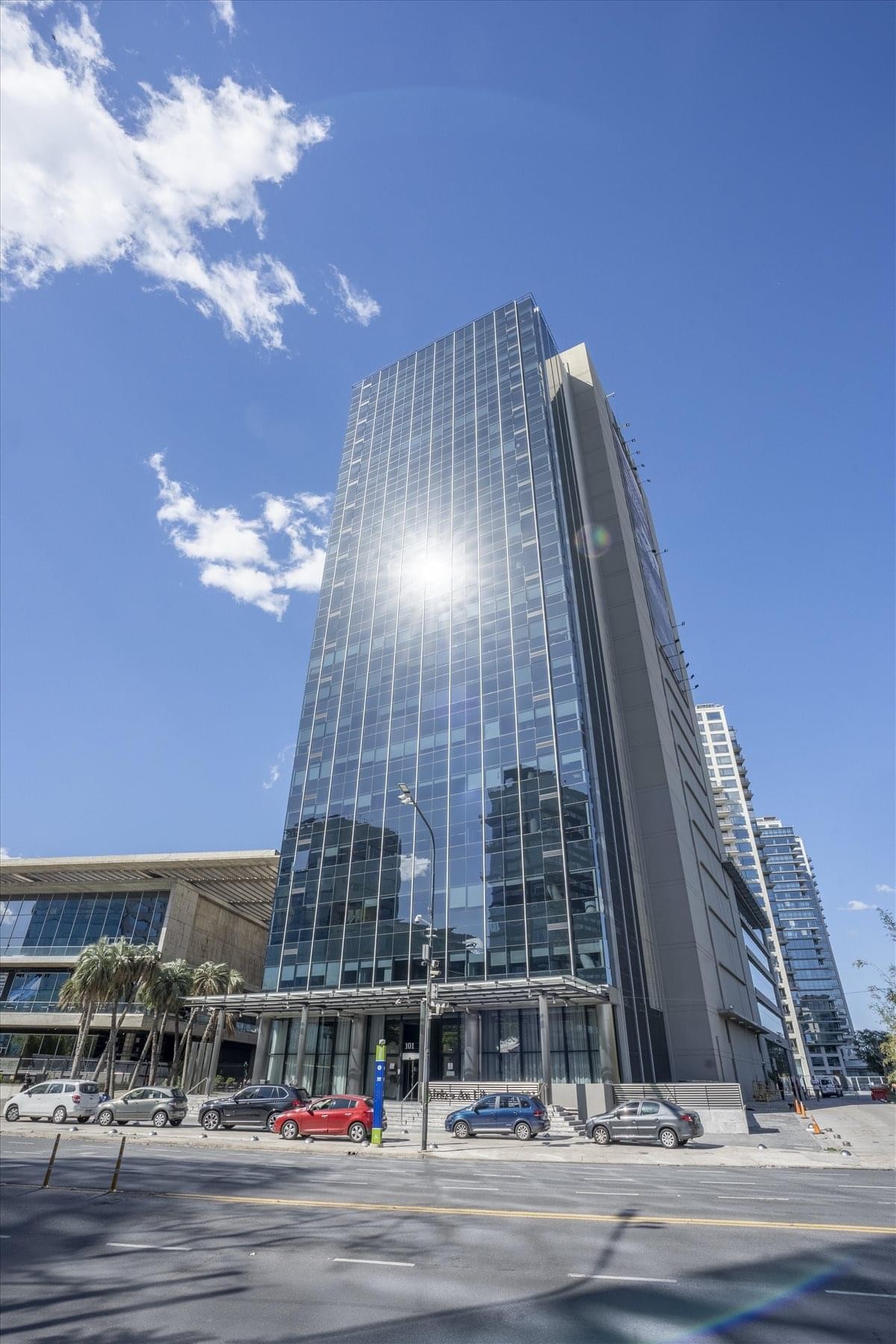 Open-plan coworking space with skylights and wooden desks at 10th Floor Torre al Rio I.