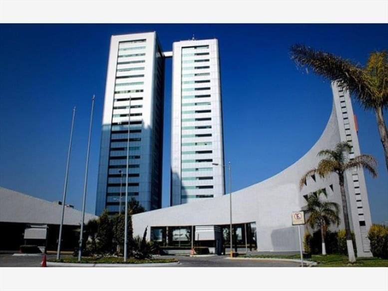 Exterior view of the modern twin-tower facade of Torre Ejecutiva JV II in Puebla.