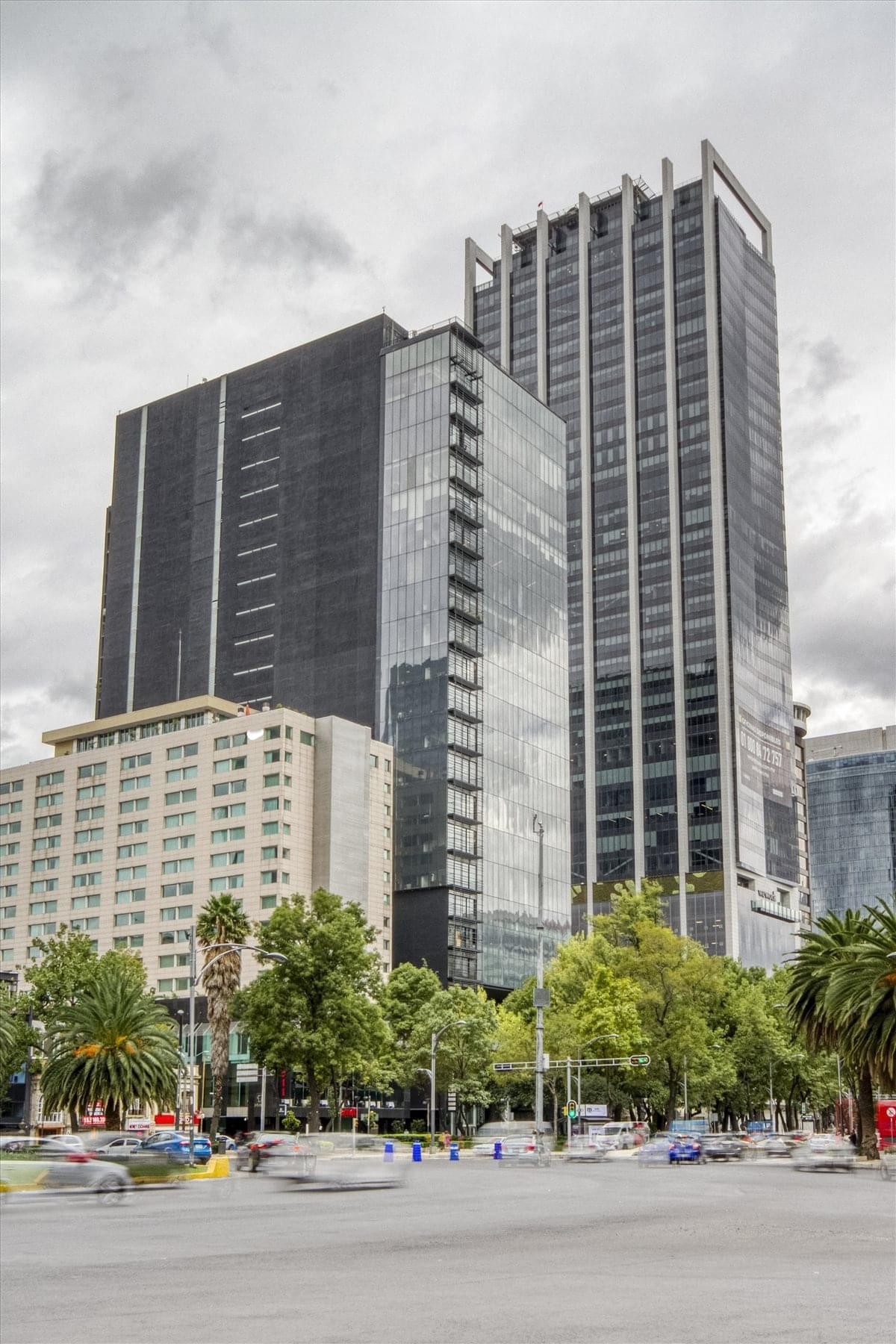 Exterior view of the glass and steel skyscraper at 17th Floor Torre Magenta.