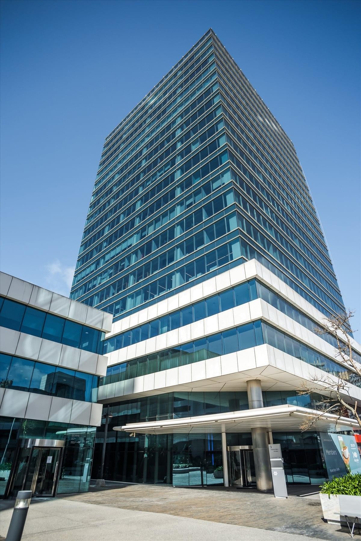 Exterior view of the glass-facade World Trade Center Tower III in Buceo.