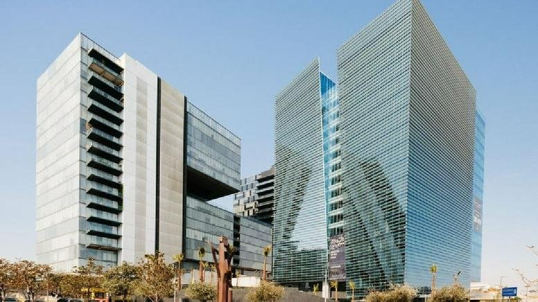 Exterior view of the modern glass-facade towers at Tower Park Plaza.