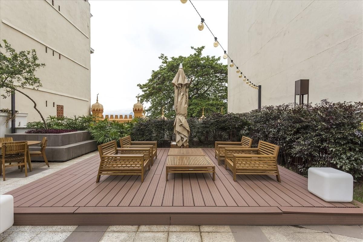 Spacious rooftop deck at Rua do Passeio, 38, with wooden flooring and comfortable seating.