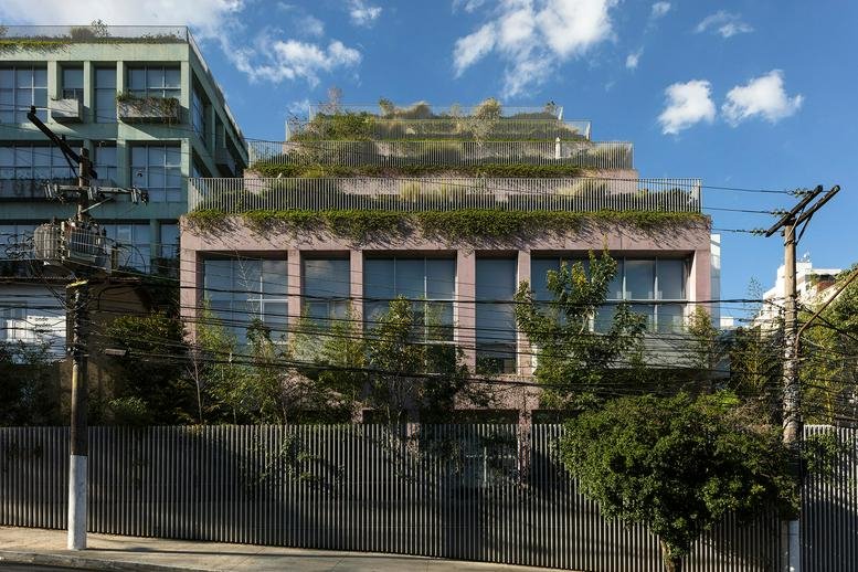 Exterior view of Sunflower 555 building with lush terraces and large windows.