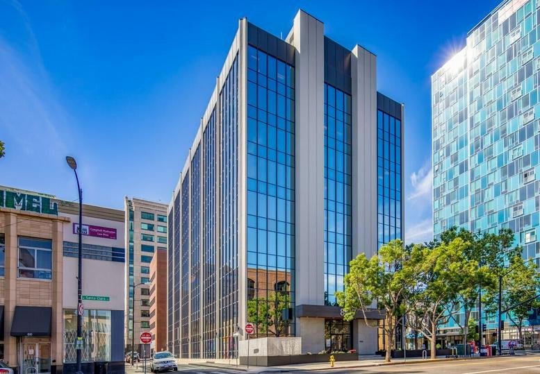 Exterior view of the modern glass and concrete building at 84 West Santa Clara St. Suite 700, San Jose.