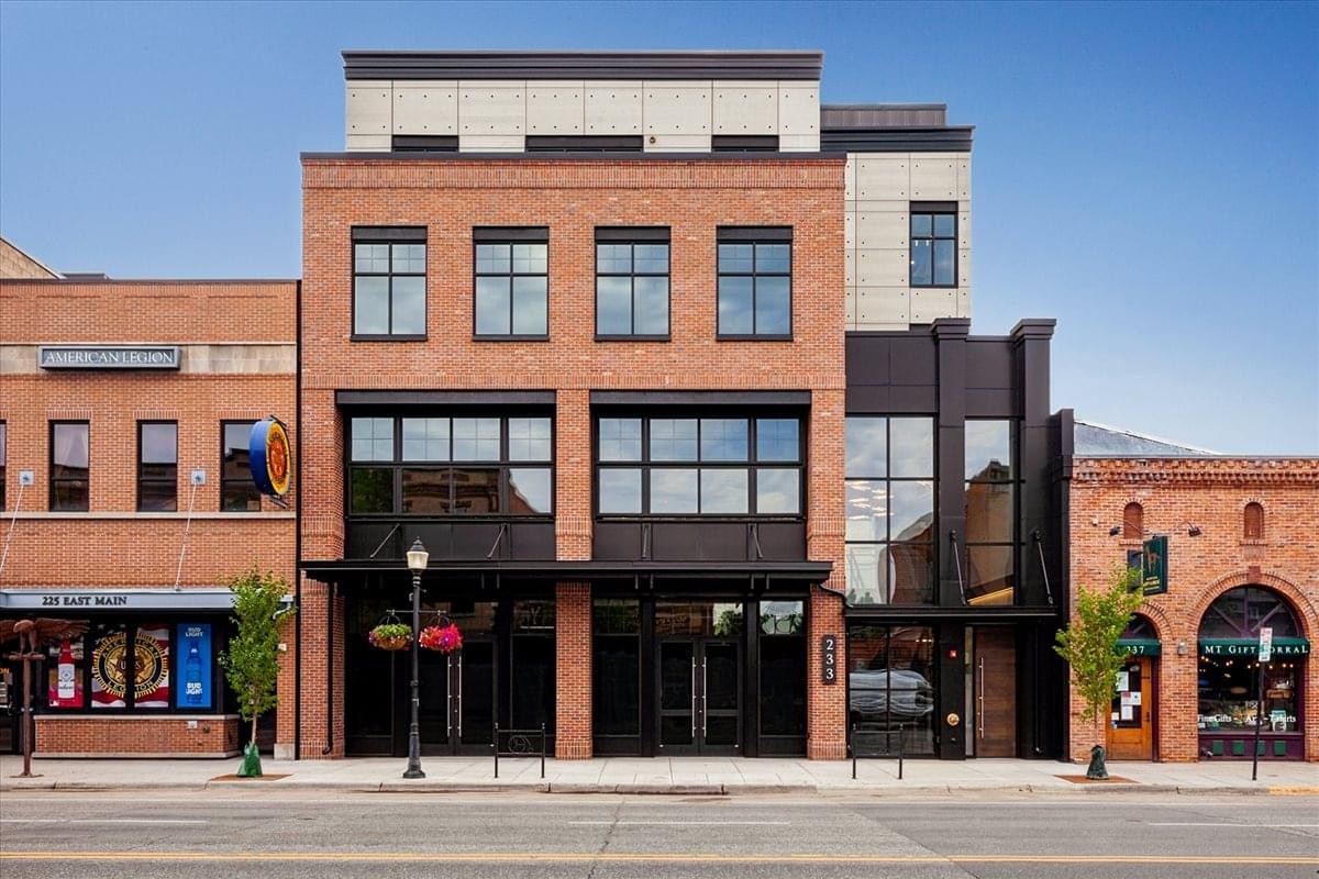 The brick and glass exterior of The Osborne building at 233 E Main St.