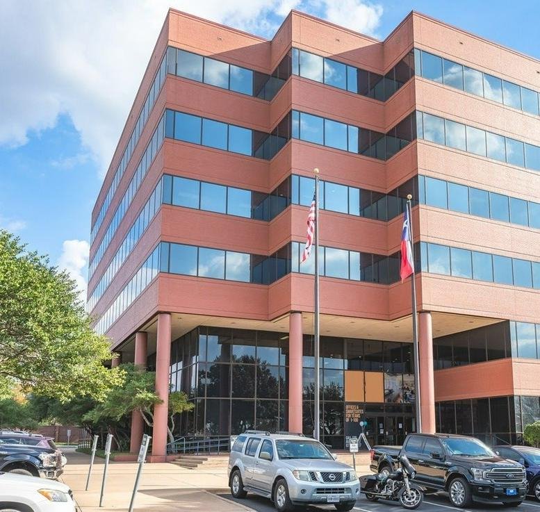 Exterior view of the red brick Wells Branch, Austin, Texas (near Robinson Ranch technology park) building.