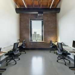 Outdoor deck area with city views and metal railings.