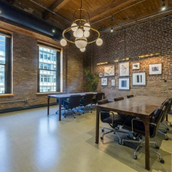 Break area featuring a large stone counter and blue tiled walls.