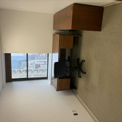 Private office suite at 121 South Broad Street with a desk and large window overlooking the city.